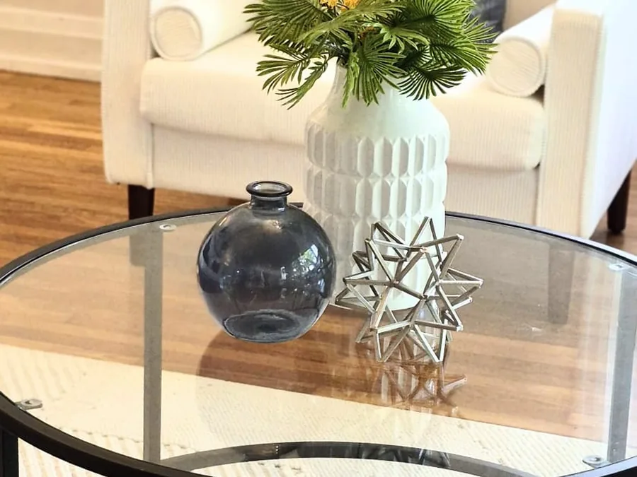 Minimal coffee table styling with greenery and sculptural accents